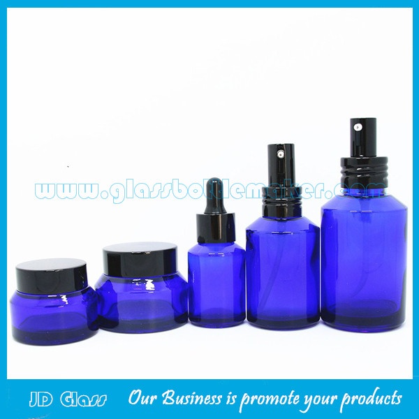 15ml-100ml Blue Sloping Shoulder Glass Lotion Bottles and 15g-50g Blue Glass Cosmetic Jars with Caps