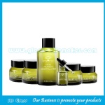 High Quality Olive Green Painting Oblique Shoulder Glass Lotion Bottles and Glass Cream Jars With Printing